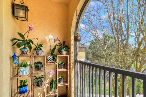 a view of a patio with a table and chairs