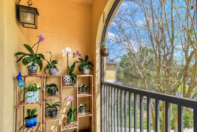 a view of a patio with a table and chairs