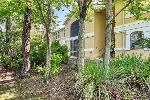 a view of a lake with a house in the background