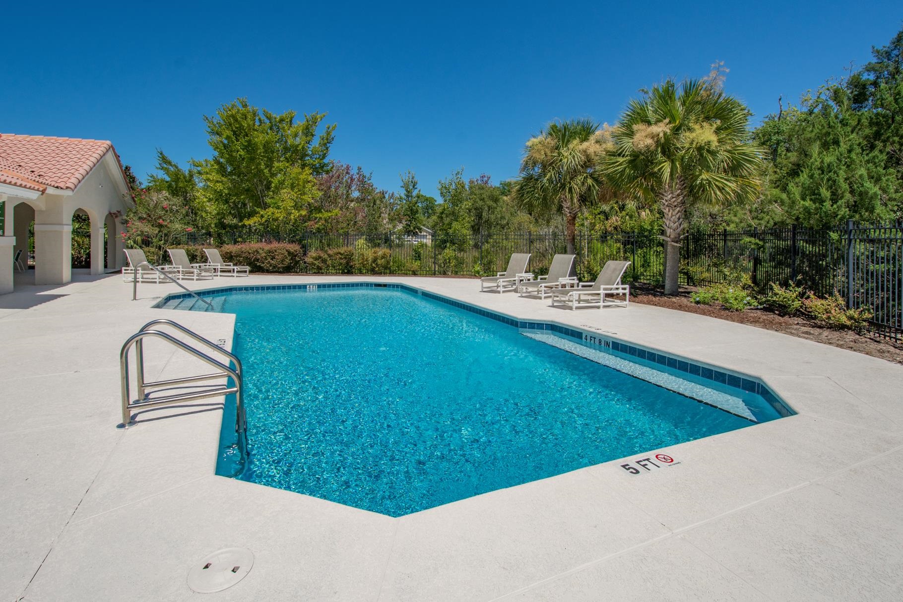 1825 Vista Cove Road St. Augustine, FL 32084 - Photo 46 of 66 a view of a swimming pool with a yard
