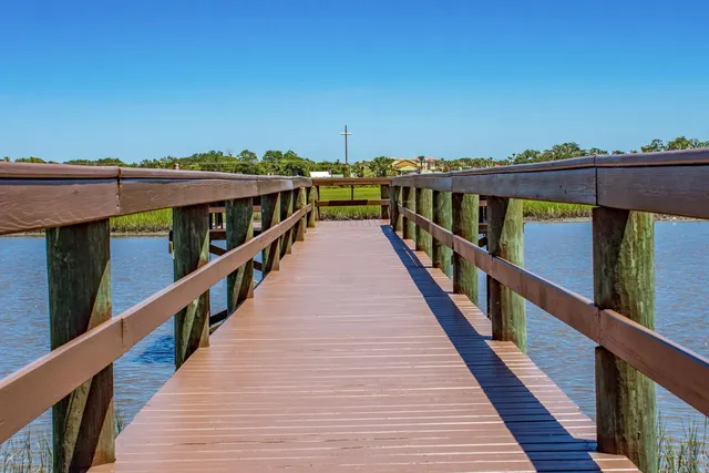 an aerial view of a house with yard swimming pool and outdoor seating