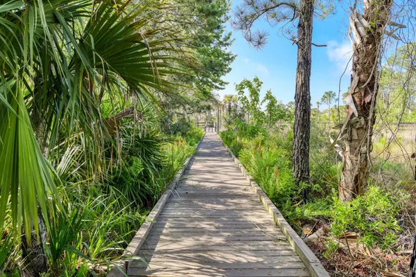 a living room with furniture a fireplace and a large window