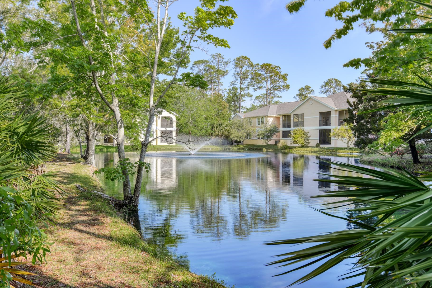 1825 Vista Cove Road St. Augustine, FL 32084 - Photo 6 of 66 a view of a lake with a house in the background