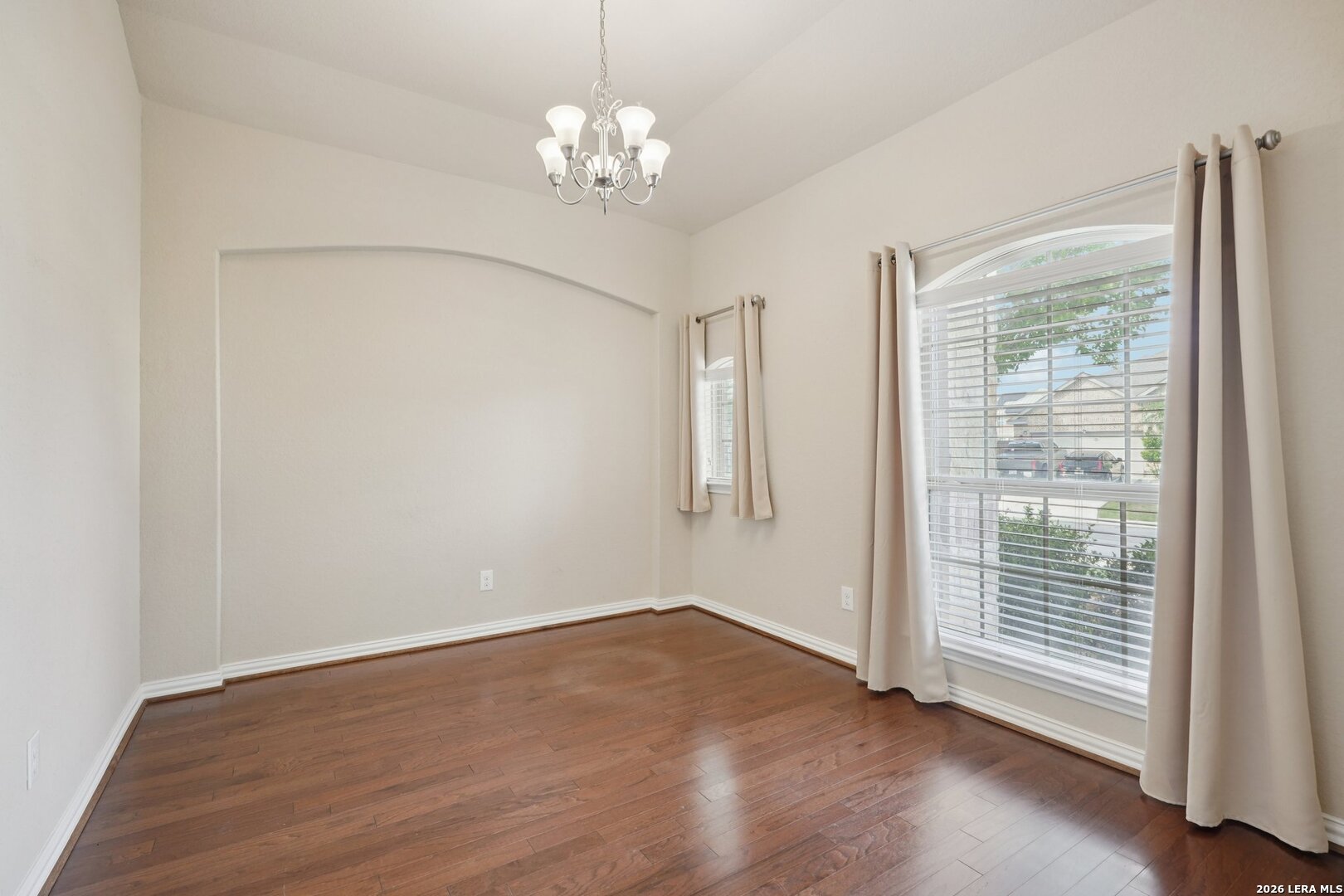 8722 Study Butte San Antonio, TX 78254 - Photo 17 of 40 a view of empty room with wooden floor and fan