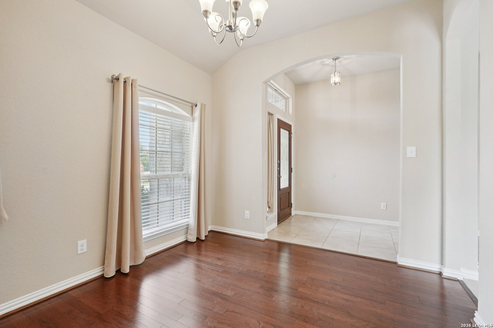 8722 Study Butte San Antonio, TX 78254 - Photo 18 of 40 an empty room with wooden floor and windows