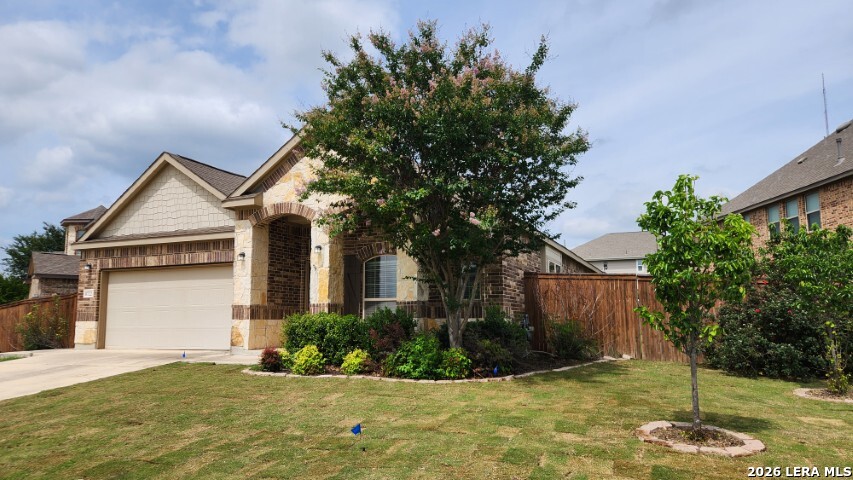 8722 Study Butte San Antonio, TX 78254 - Photo 2 of 40 a front view of a house with garden