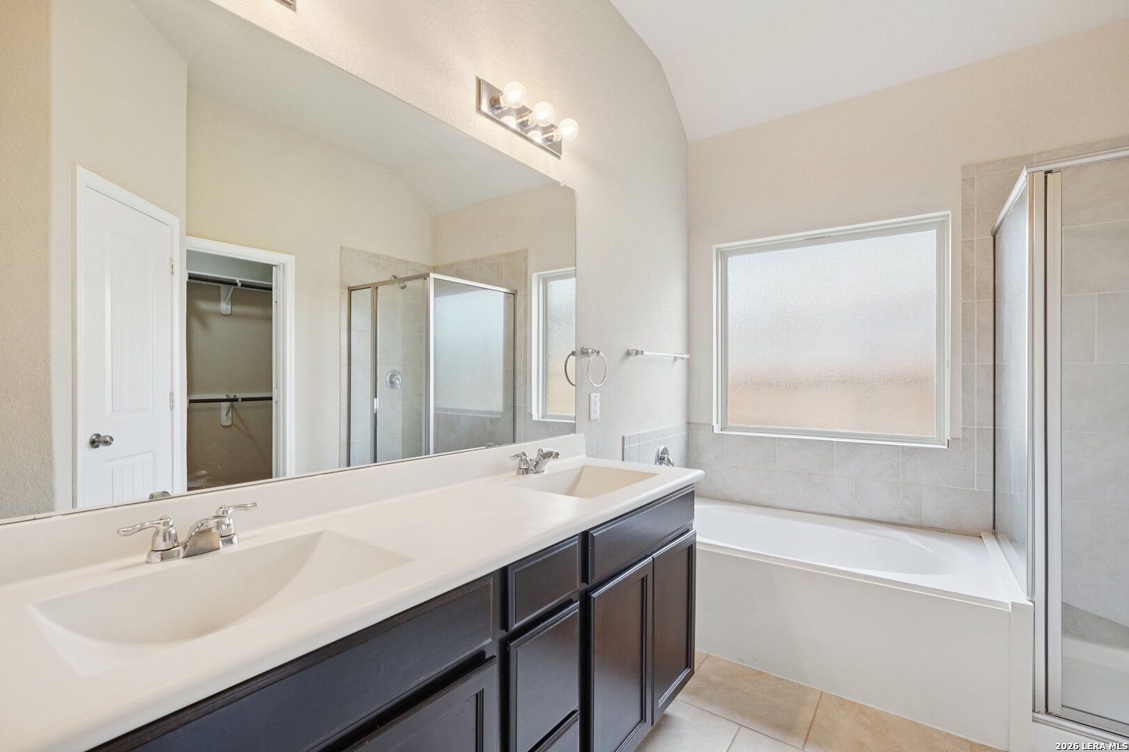 8722 Study Butte San Antonio, TX 78254 - Photo 22 of 40 a bathroom with a tub sink and mirror
