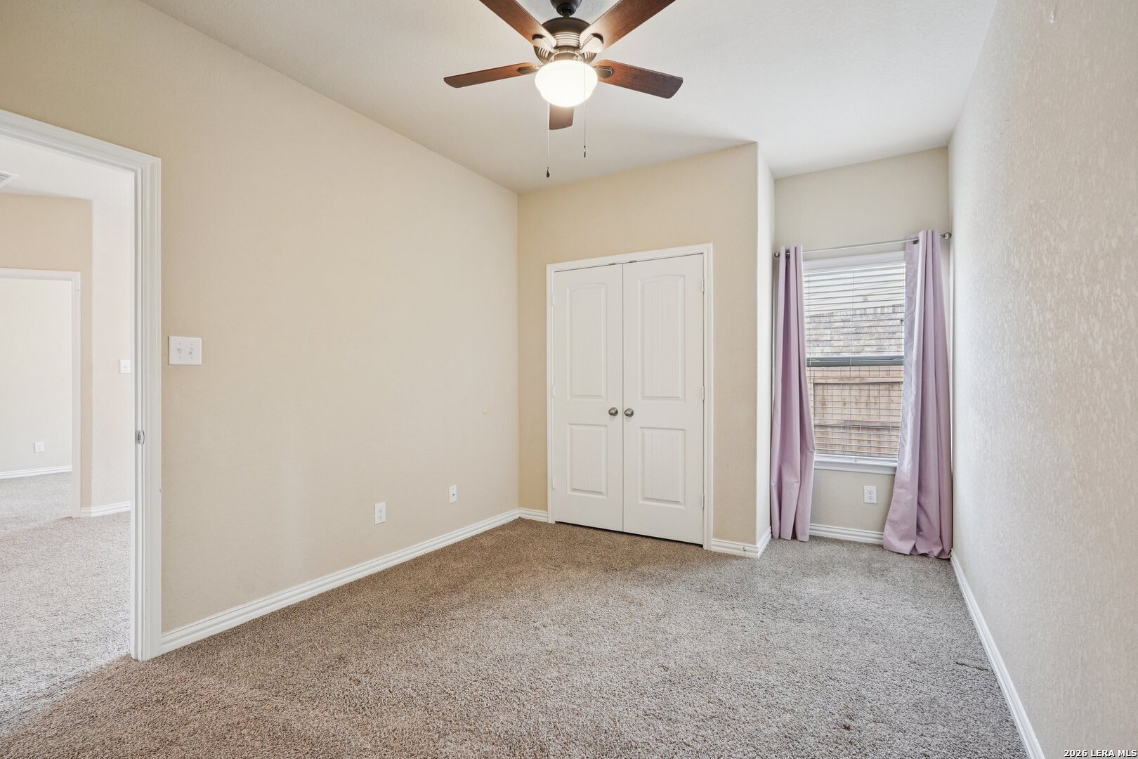 8722 Study Butte San Antonio, TX 78254 - Photo 29 of 40 an empty room with closet and fan