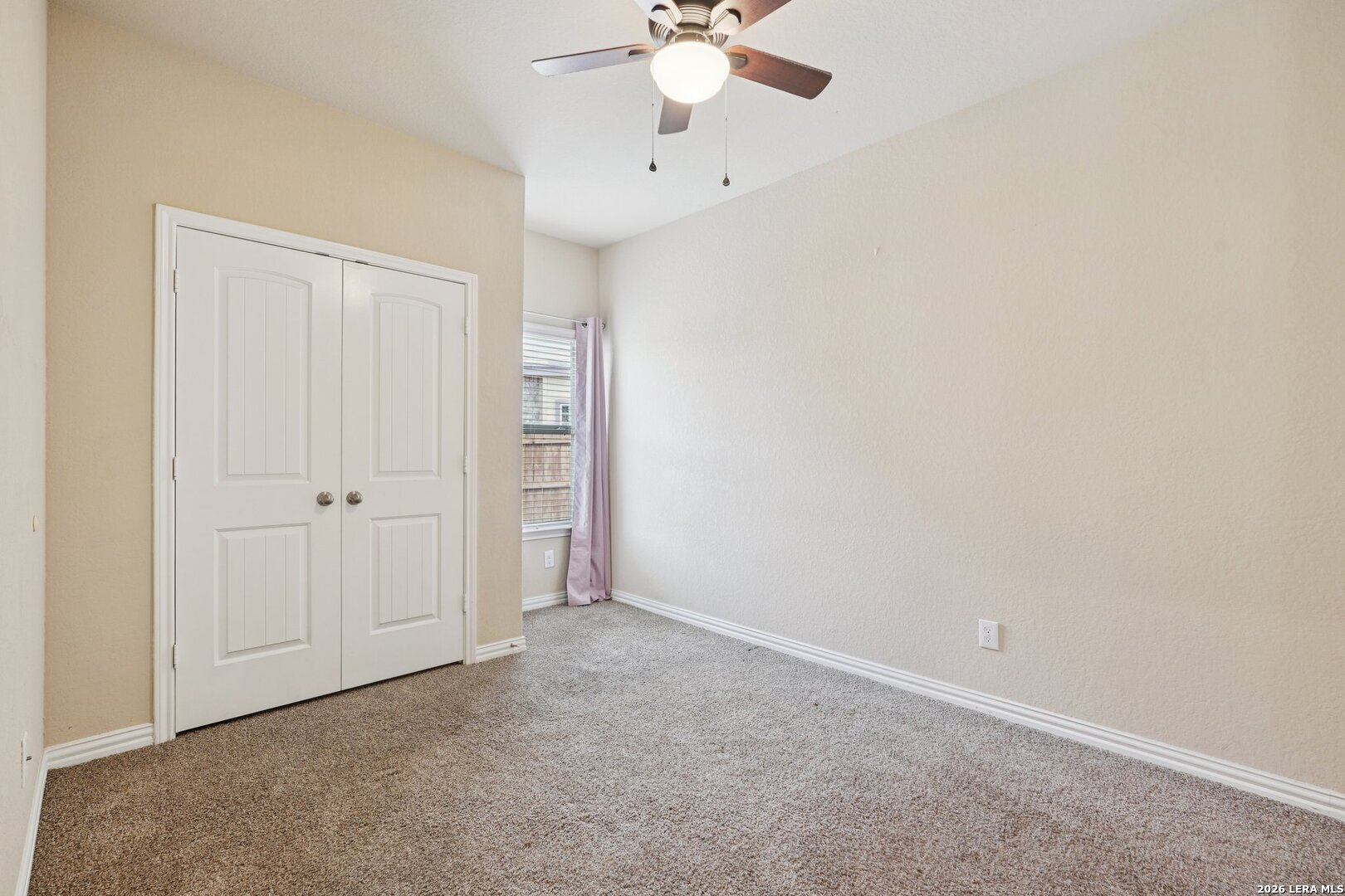 8722 Study Butte San Antonio, TX 78254 - Photo 30 of 40 an empty room with a ceiling fan and a window