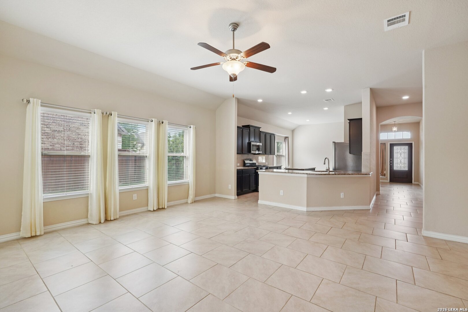 8722 Study Butte San Antonio, TX 78254 - Photo 7 of 40 a view of a kitchen with furniture and a large window