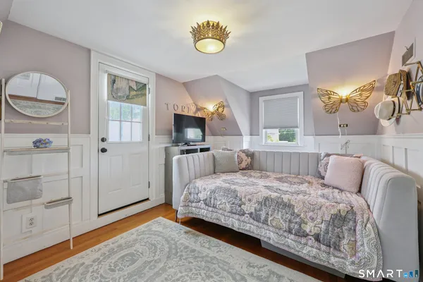 a bedroom with a bed and cabinets