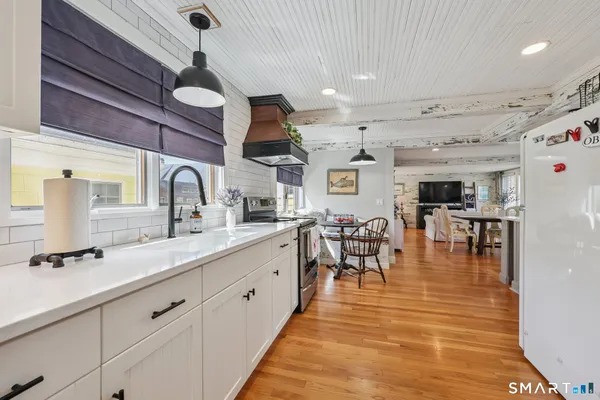 a very nice looking kitchen with a large window