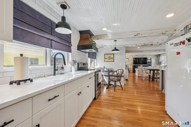 a very nice looking kitchen with a large window