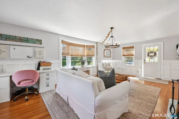 a living room with furniture and a window