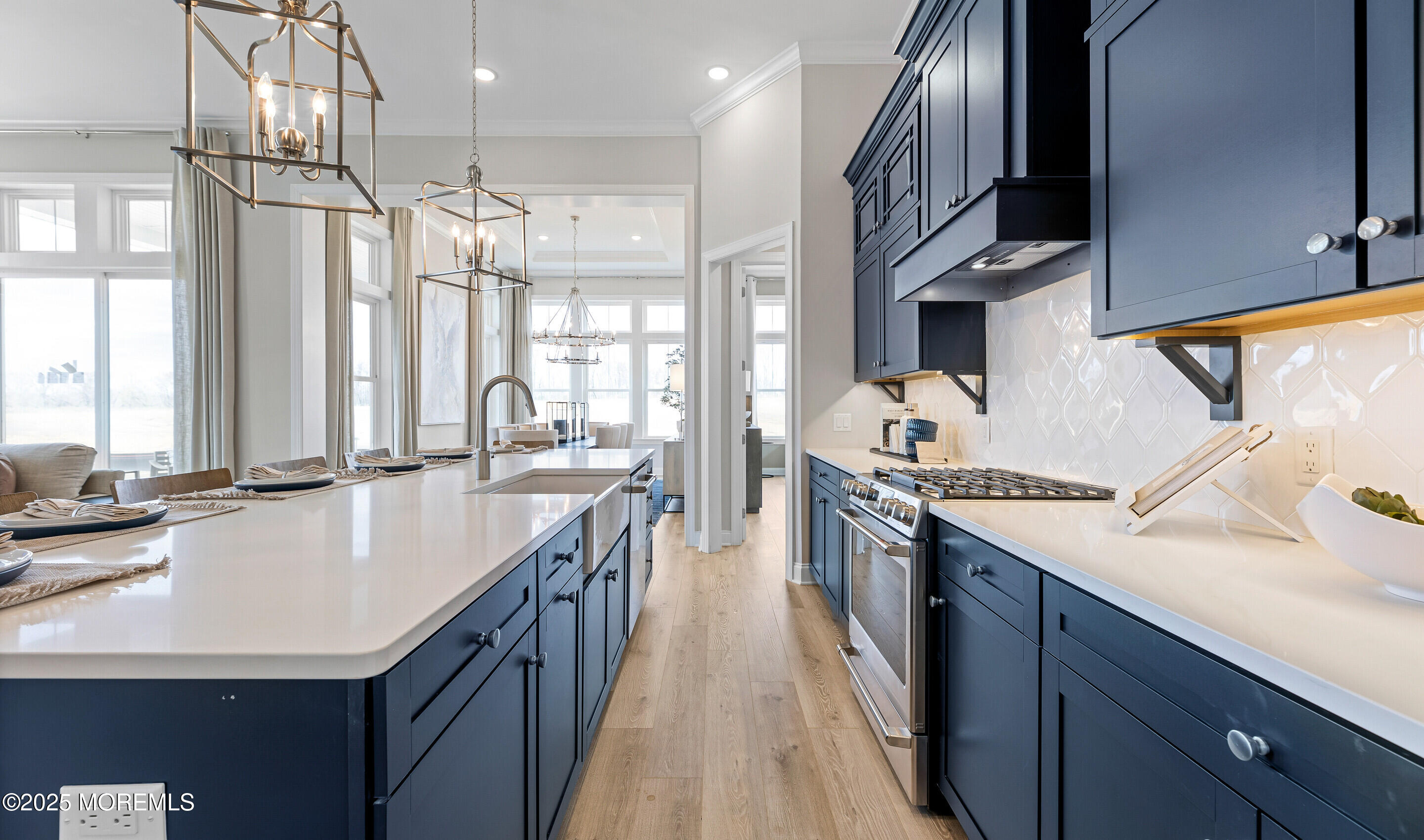 176 Highway 33, Unit KILLARNEY III LOFT Manalapan, NJ 07726 - Photo 13 of 41 a large kitchen with stainless steel appliances granite countertop a sink stove and refrigerator