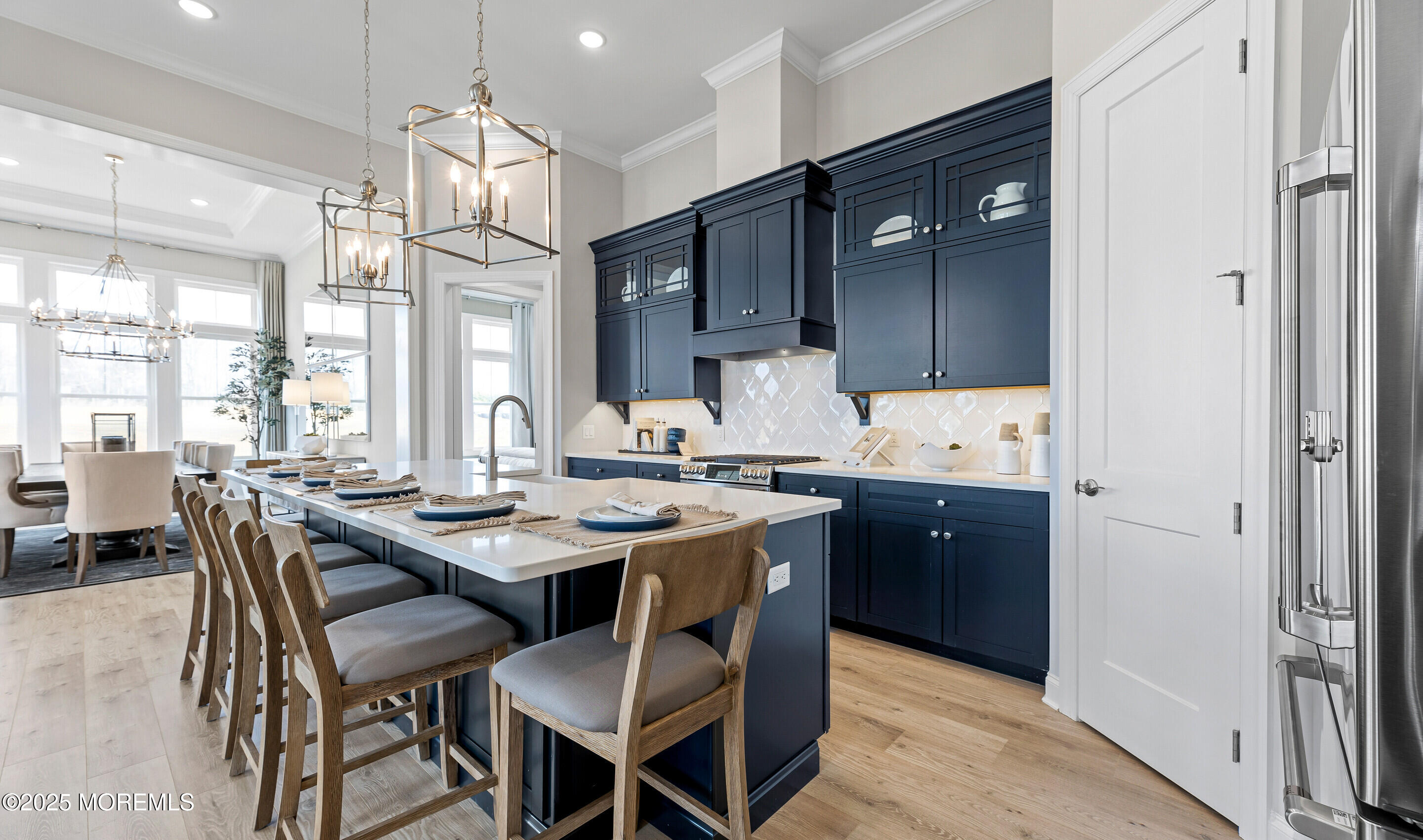 176 Highway 33, Unit KILLARNEY III LOFT Manalapan, NJ 07726 - Photo 14 of 41 a kitchen with granite countertop a sink cabinets and wooden floor