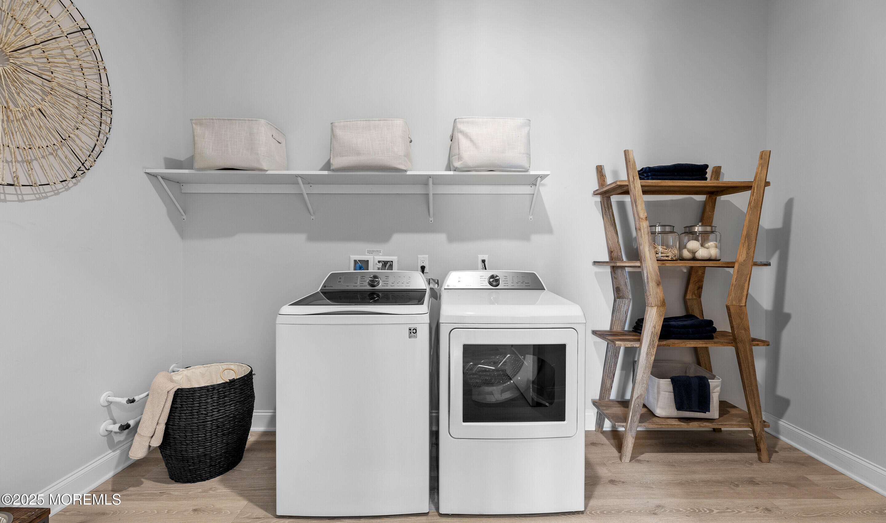 176 Highway 33, Unit KILLARNEY III LOFT Manalapan, NJ 07726 - Photo 15 of 41 a view of a storage and utility room with washer and dryer