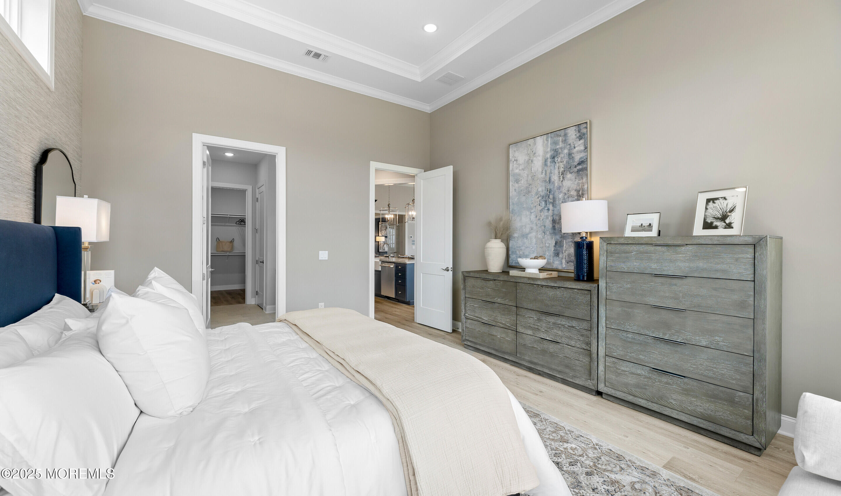 176 Highway 33, Unit KILLARNEY III LOFT Manalapan, NJ 07726 - Photo 24 of 41 a bedroom with a bed and a dresser