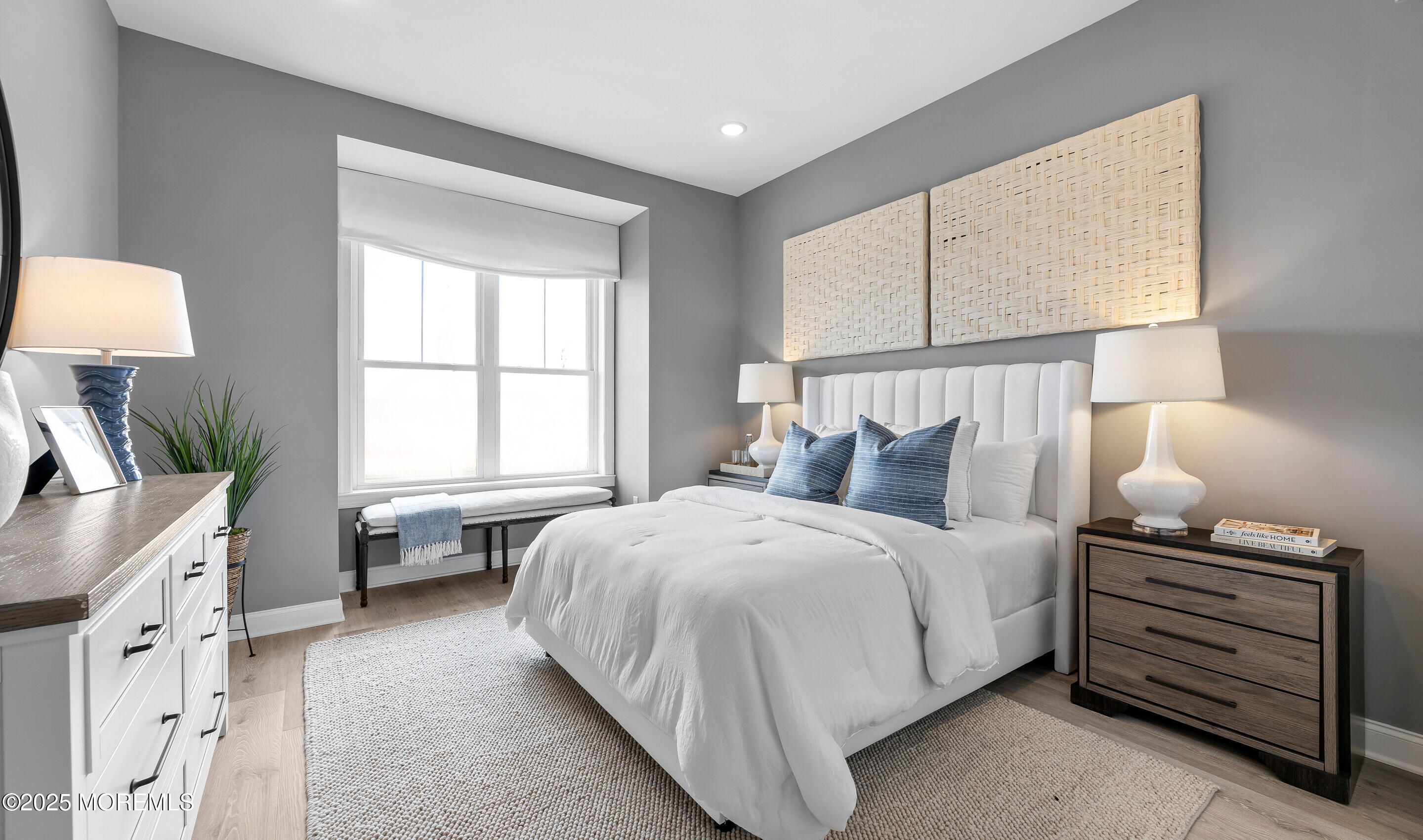 176 Highway 33, Unit KILLARNEY III LOFT Manalapan, NJ 07726 - Photo 27 of 41 a bedroom with a bed and a window