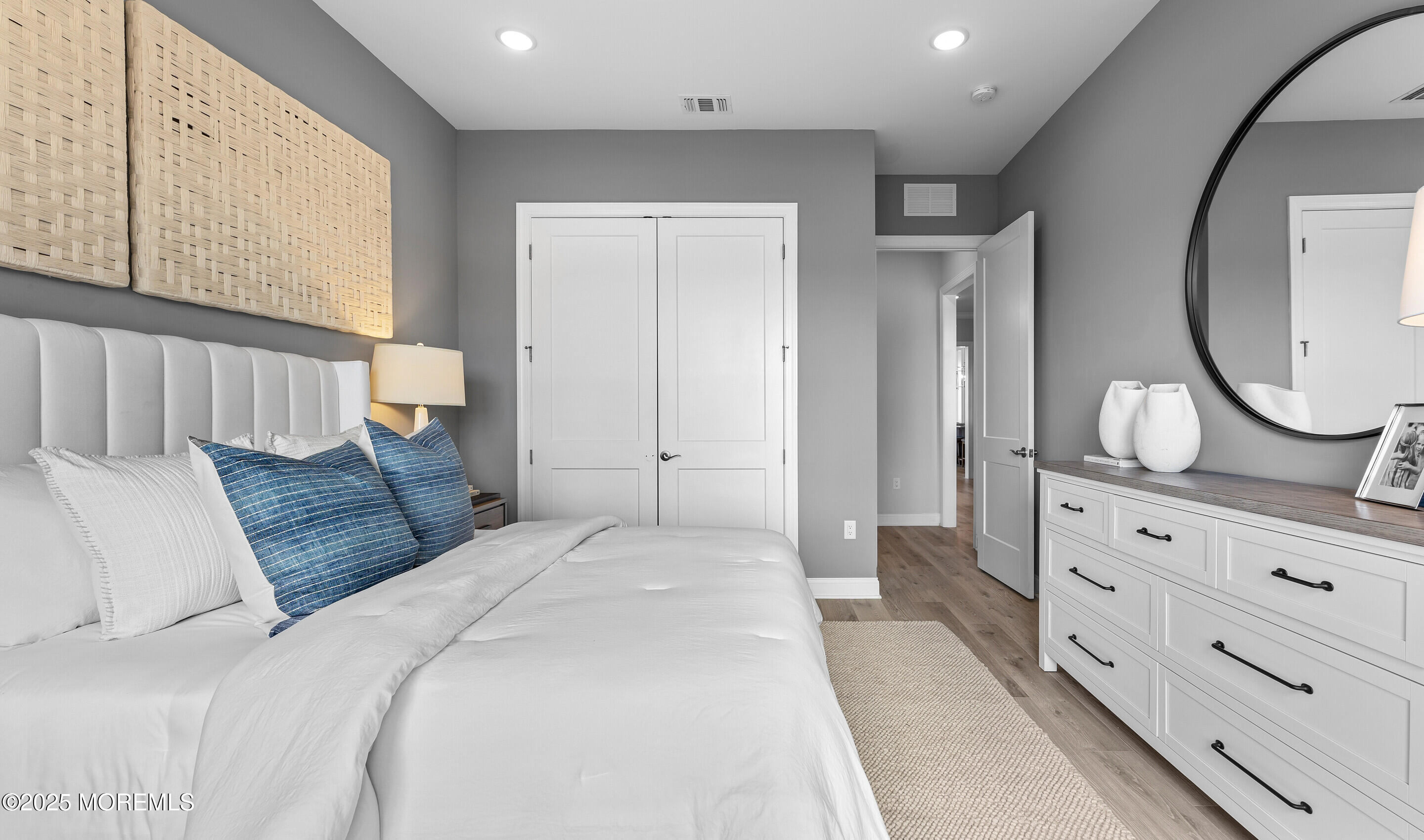 176 Highway 33, Unit KILLARNEY III LOFT Manalapan, NJ 07726 - Photo 28 of 41 a bedroom with a bed and a dresser