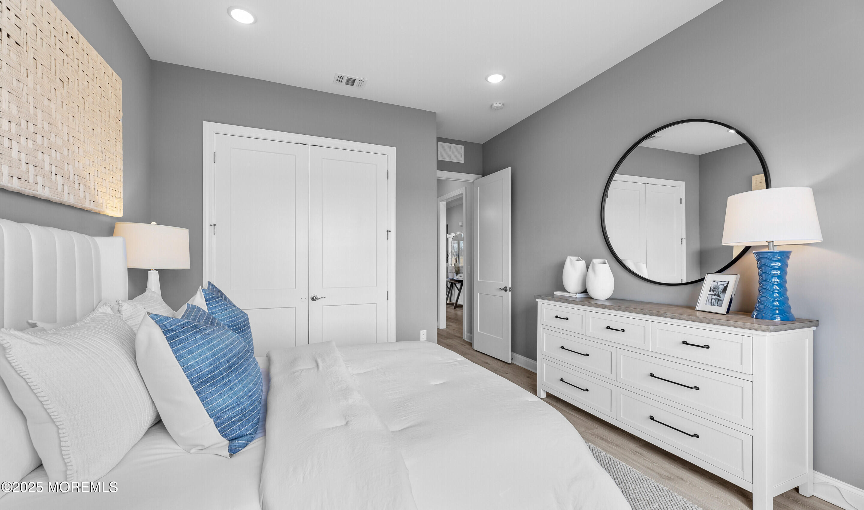 176 Highway 33, Unit KILLARNEY III LOFT Manalapan, NJ 07726 - Photo 29 of 41 a bedroom with a bed and a dresser