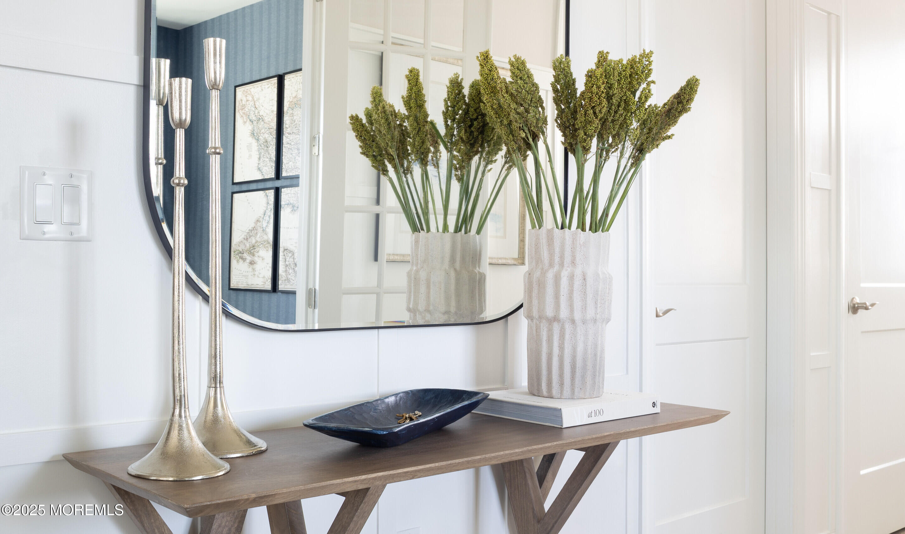 176 Highway 33, Unit KILLARNEY III LOFT Manalapan, NJ 07726 - Photo 30 of 41 a vase of flowers sitting next to a wooden floor