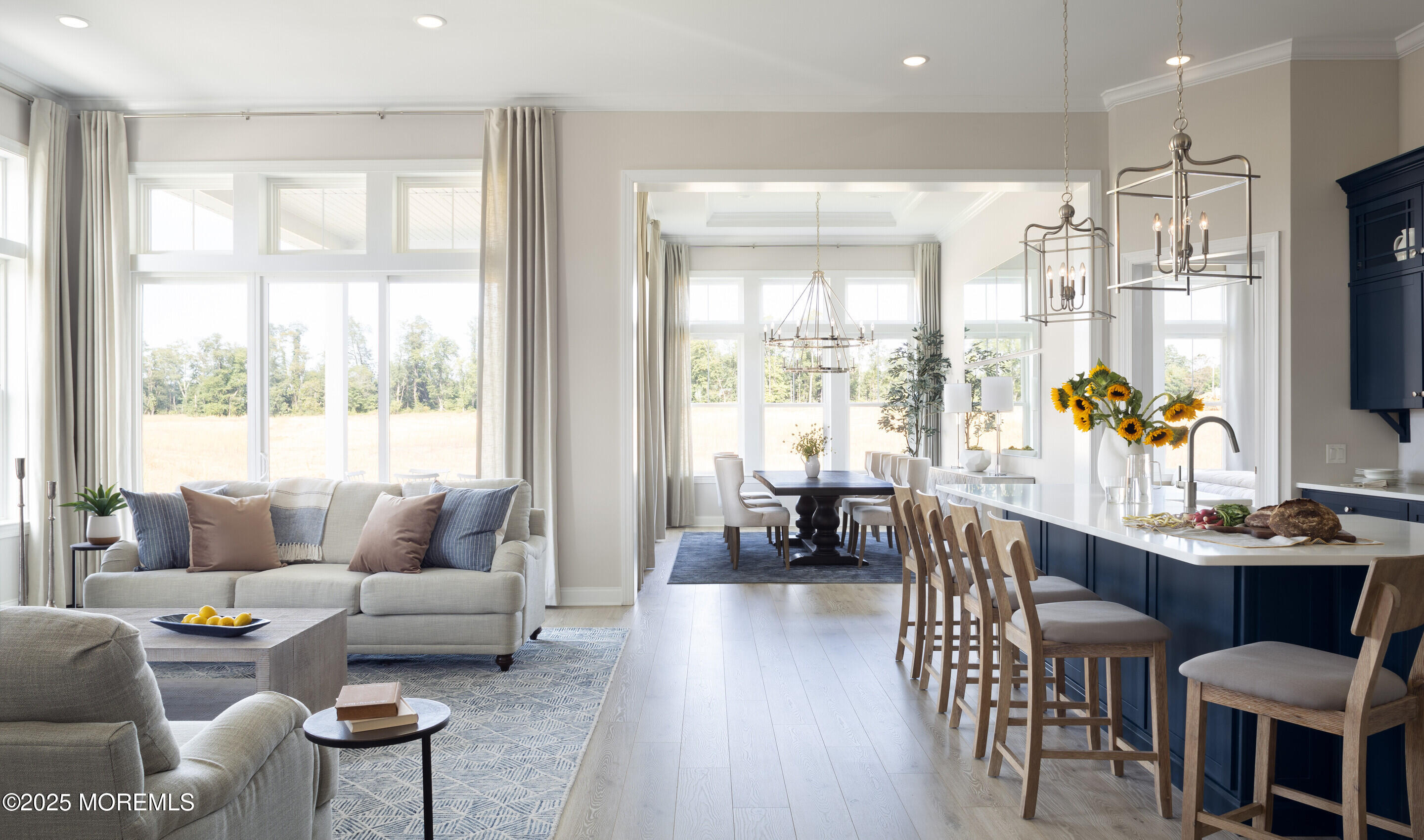 176 Highway 33, Unit KILLARNEY III LOFT Manalapan, NJ 07726 - Photo 32 of 41 a living room with furniture a flat screen tv and a large window