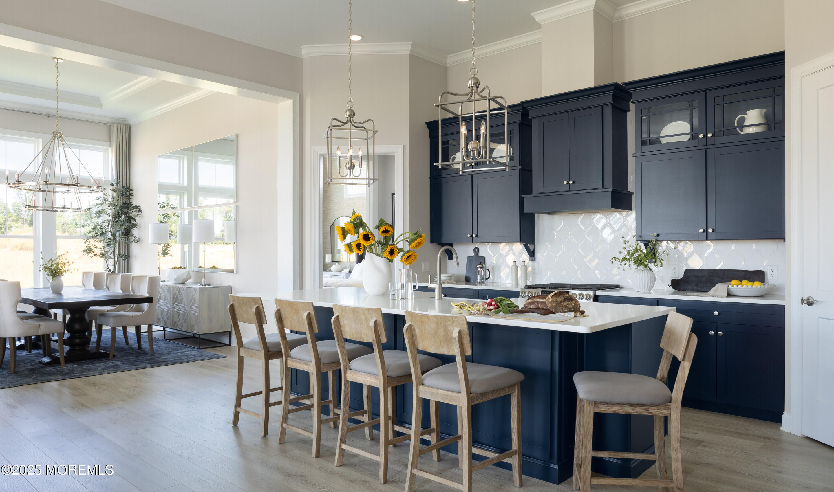 176 Highway 33, Unit KILLARNEY III LOFT Manalapan, NJ 07726 - Photo 36 of 41 a dining room with furniture and wooden floor