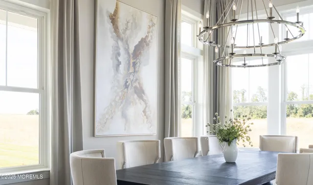 a vase of flowers sitting next to a window