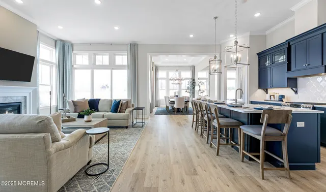 a living room with fireplace furniture and a flat screen tv