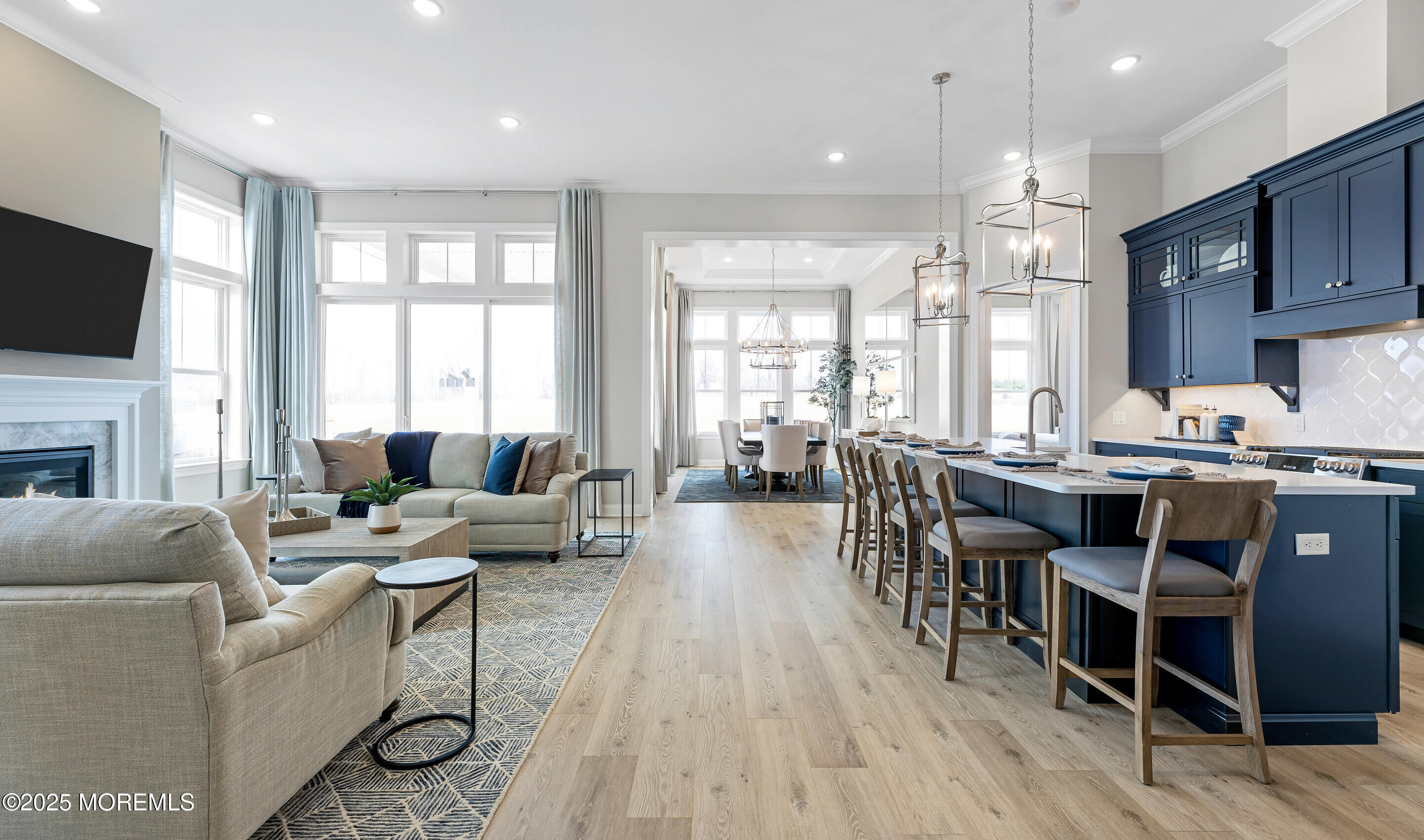 176 Highway 33, Unit KILLARNEY III LOFT Manalapan, NJ 07726 - Photo 5 of 41 a living room with fireplace furniture and a flat screen tv