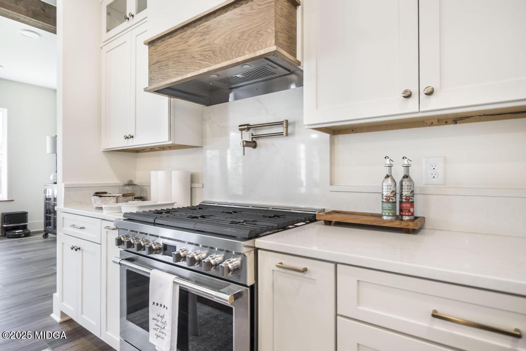 1731 Blue Springs Road Buckhead, GA 30625 - Photo 32 of 50 a kitchen with stainless steel appliances granite countertop a stove a sink and white cabinets