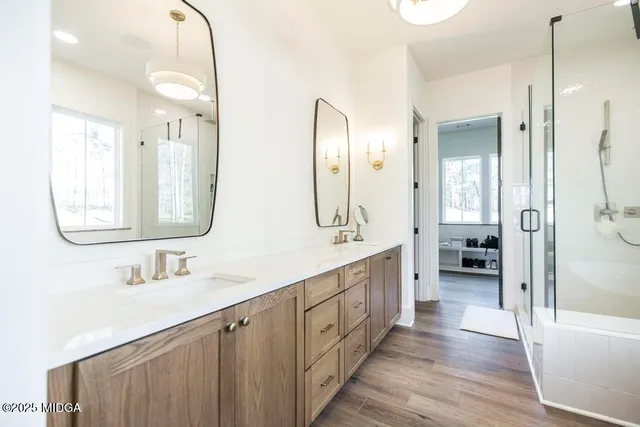 a large bathroom with a double vanity sink and a large mirror