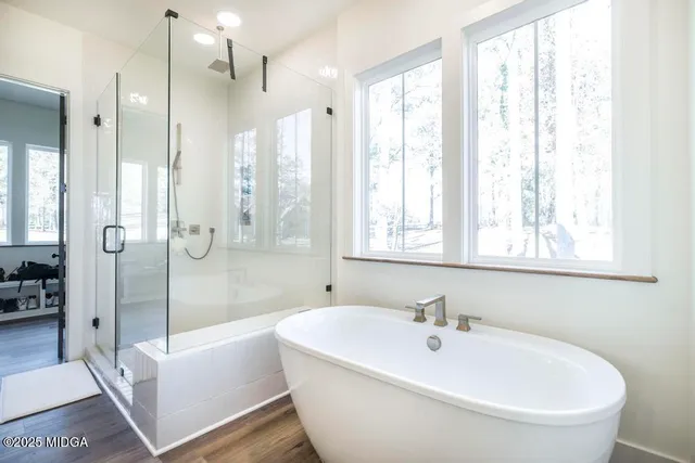 a bathroom with a bathtub and a shower