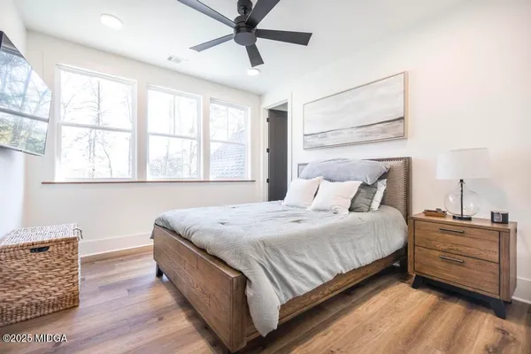 a bedroom with bed and window
