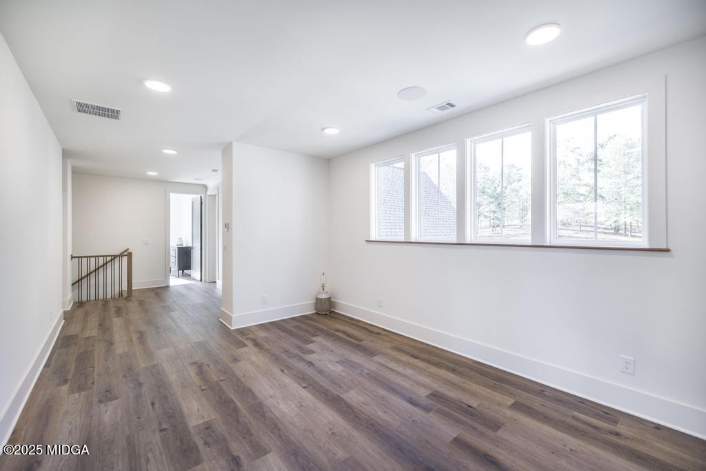 1731 Blue Springs Road Buckhead, GA 30625 - Photo 50 of 50 a view of an empty room with wooden floor and a window