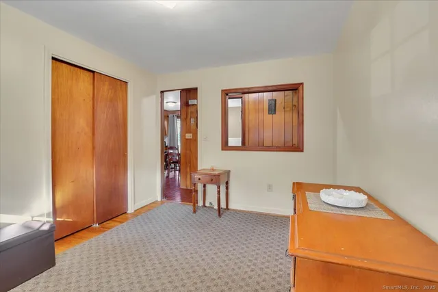 a view of a room with window and bathroom