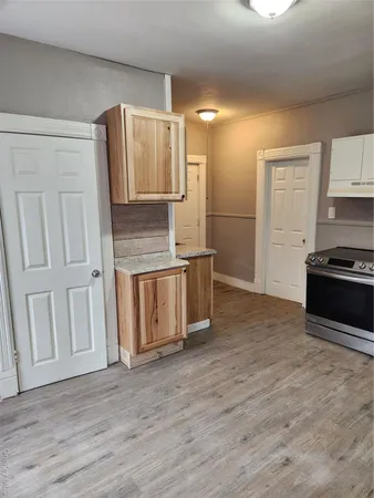 a kitchen with stainless steel appliances a refrigerator and a stove