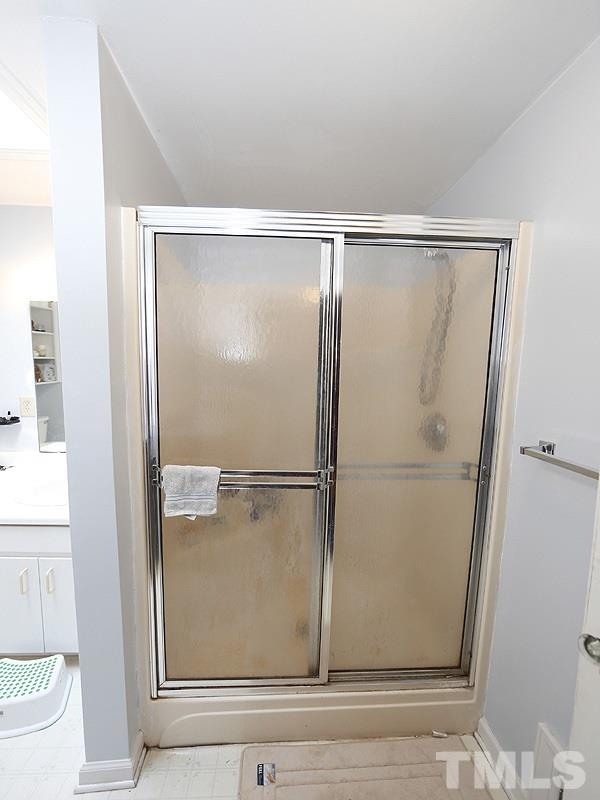 2613 Van Dyke Avenue Raleigh, NC 27607 - Photo 14 of 24 a bathroom with a glass shower door
