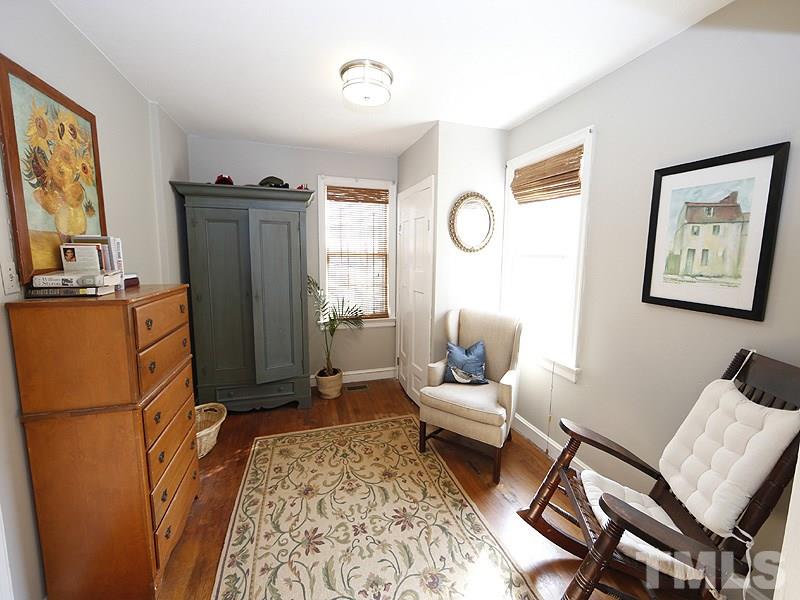 2613 Van Dyke Avenue Raleigh, NC 27607 - Photo 16 of 24 a living room with furniture a window and a refrigerator