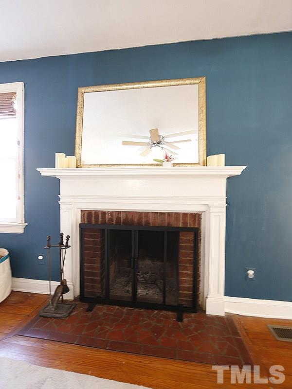 2613 Van Dyke Avenue Raleigh, NC 27607 - Photo 3 of 24 a living room with a fireplace