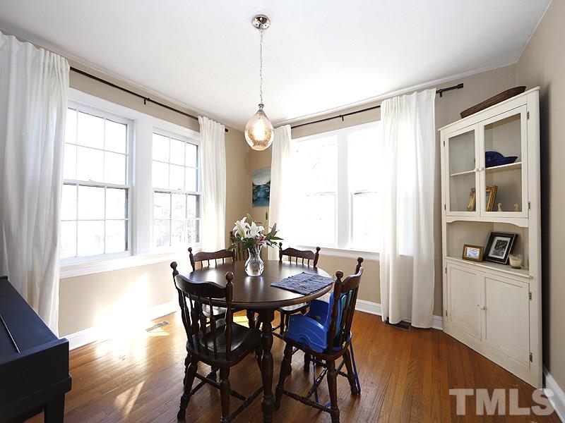 2613 Van Dyke Avenue Raleigh, NC 27607 - Photo 4 of 24 a view of a dining room with furniture window and wooden floor