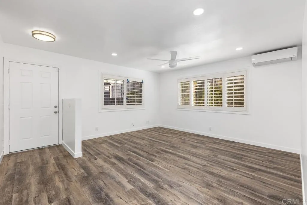 889 Bracero Road Encinitas, CA 92024 - Photo 30 of 59 a view of empty room with wooden floor and fan