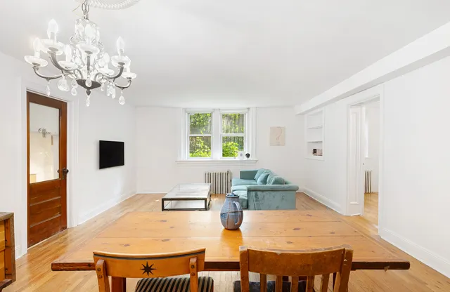 a kitchen with stainless steel appliances granite countertop a sink a stove and cabinets