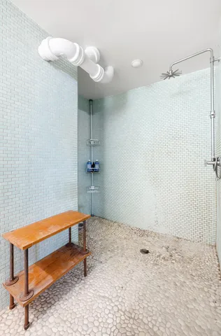 a living room with furniture and a chair