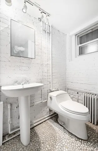 a bench sitting in a bathroom