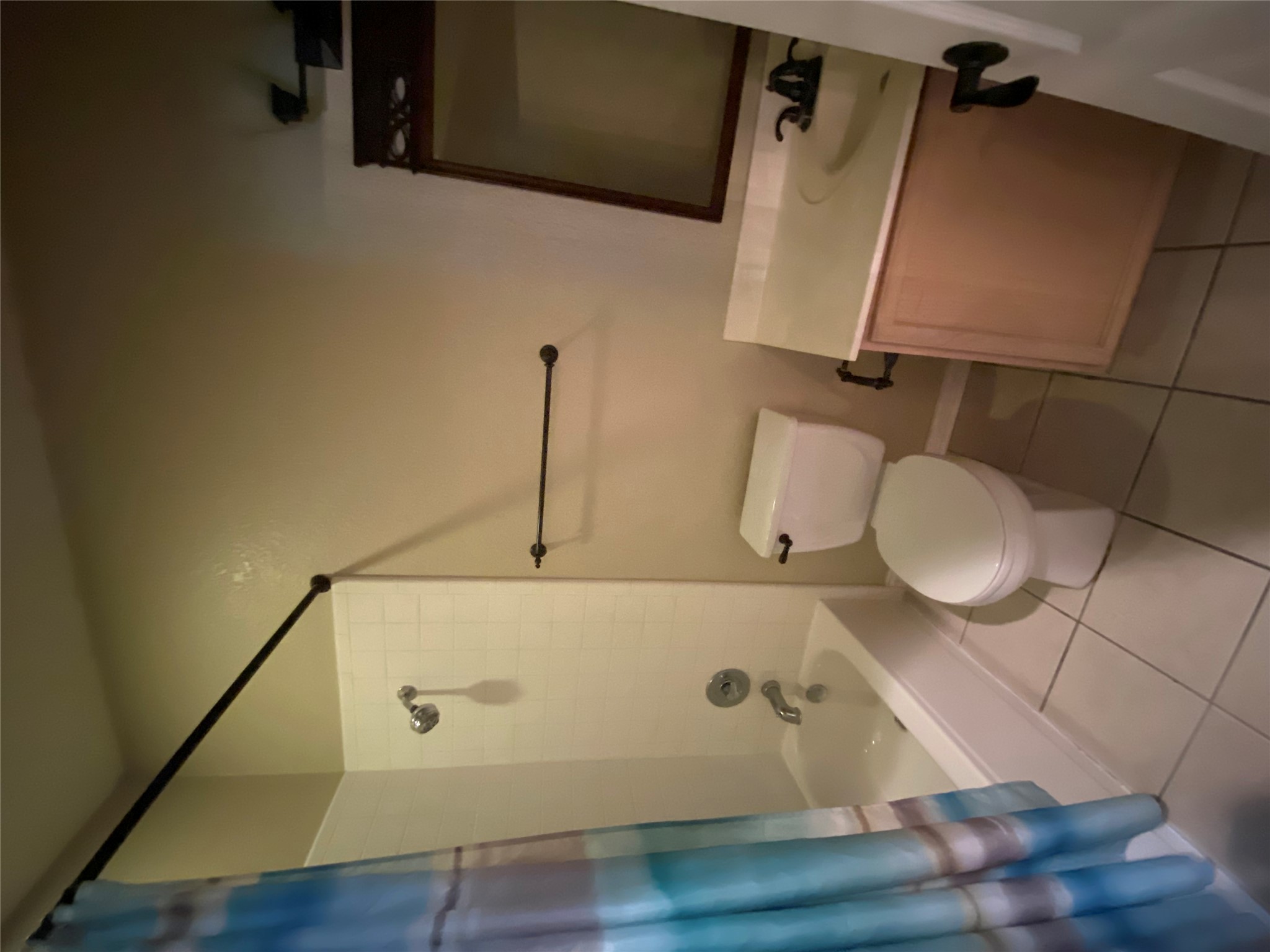 1404 Terra Street Round Rock, TX 78665 - Photo 9 of 15 Bathroom featuring shower / bath combo, vanity, and light tile patterned floors