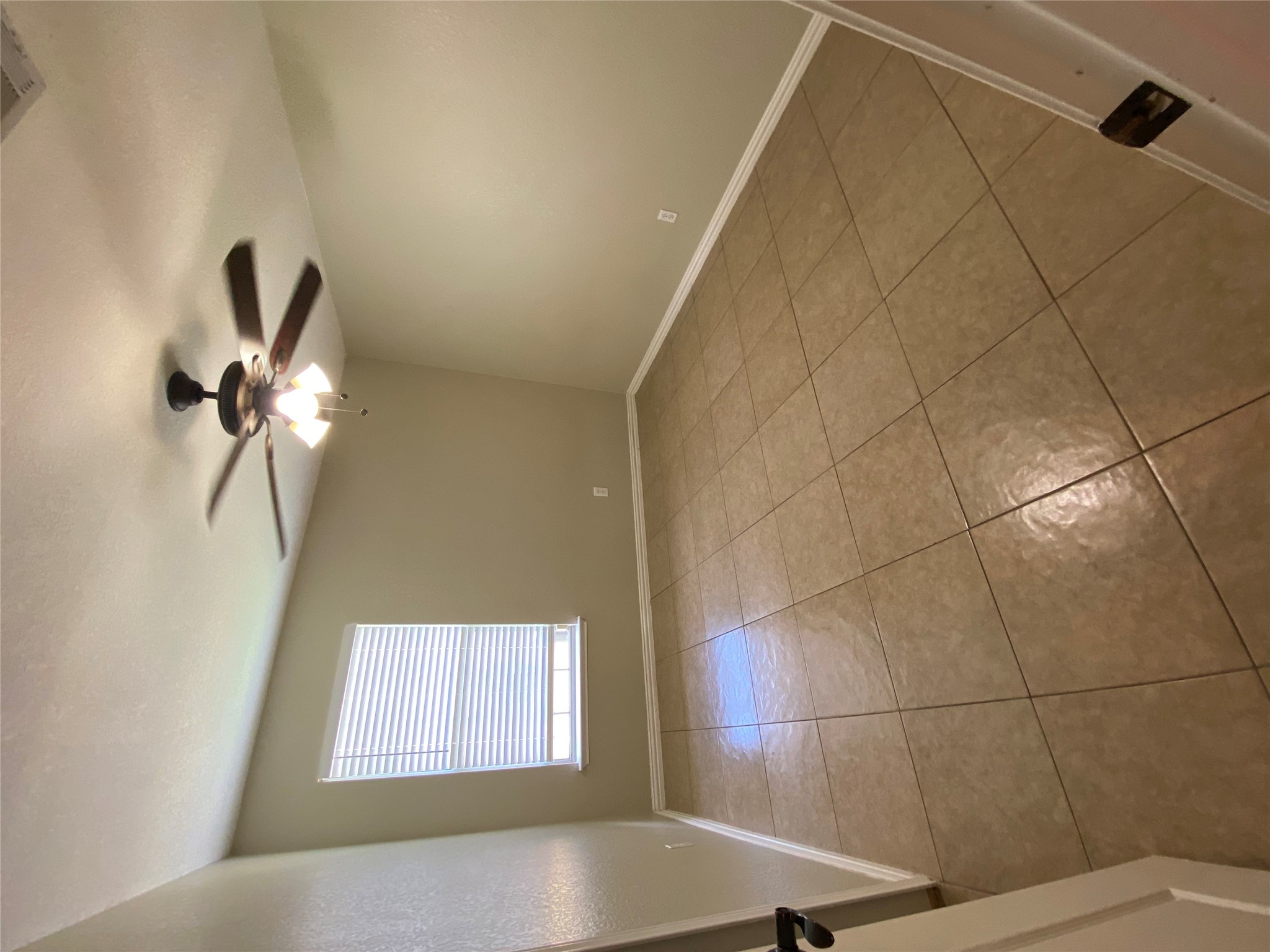 1404 Terra Street Round Rock, TX 78665 - Photo 10 of 15 Unfurnished room with a ceiling fan and light tile patterned floors