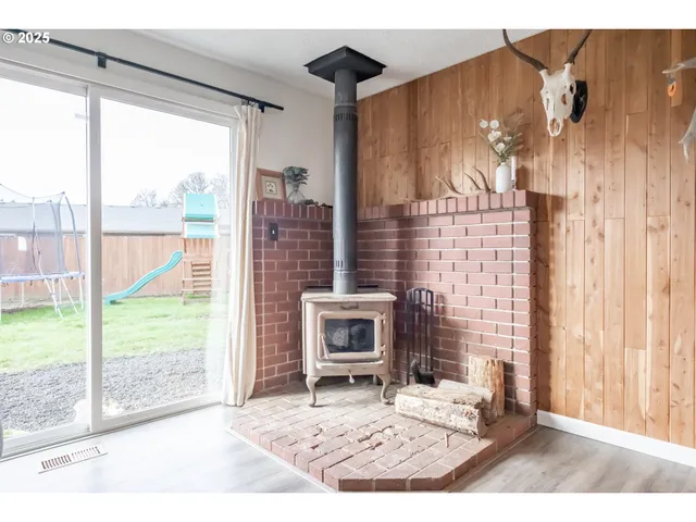 a view of a room that has a bed and a window