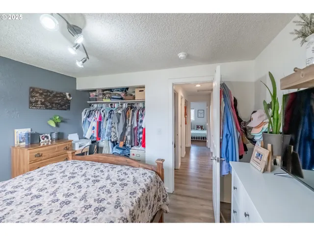 a view of a livingroom with furniture and a flat screen tv